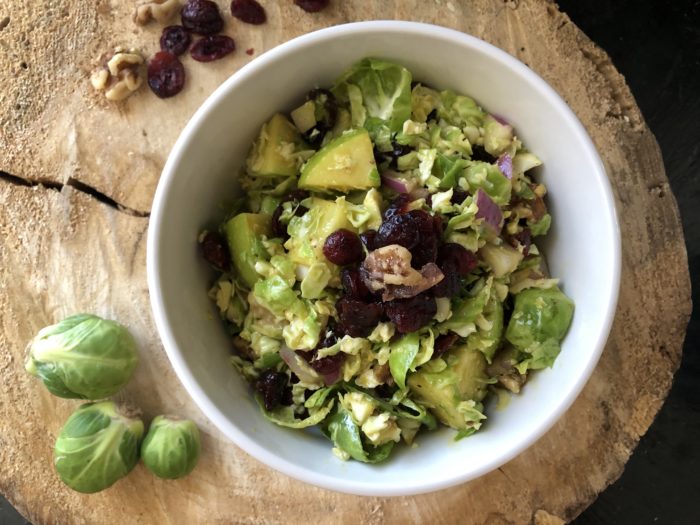 Brussels sprouts salad with cranberries, apple, maple, dijon