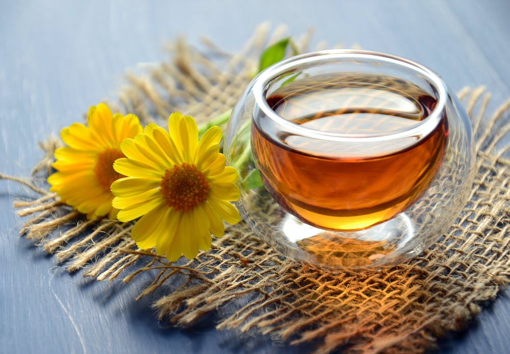 Fennel tea with two sunflowers.