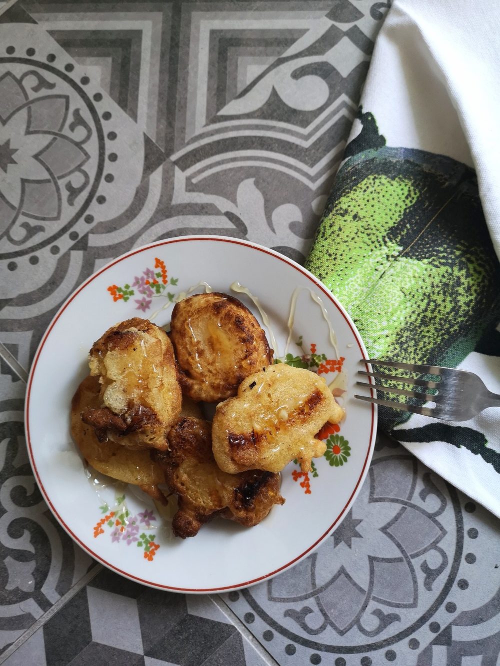 crispy fried bananas on a plate with a fork