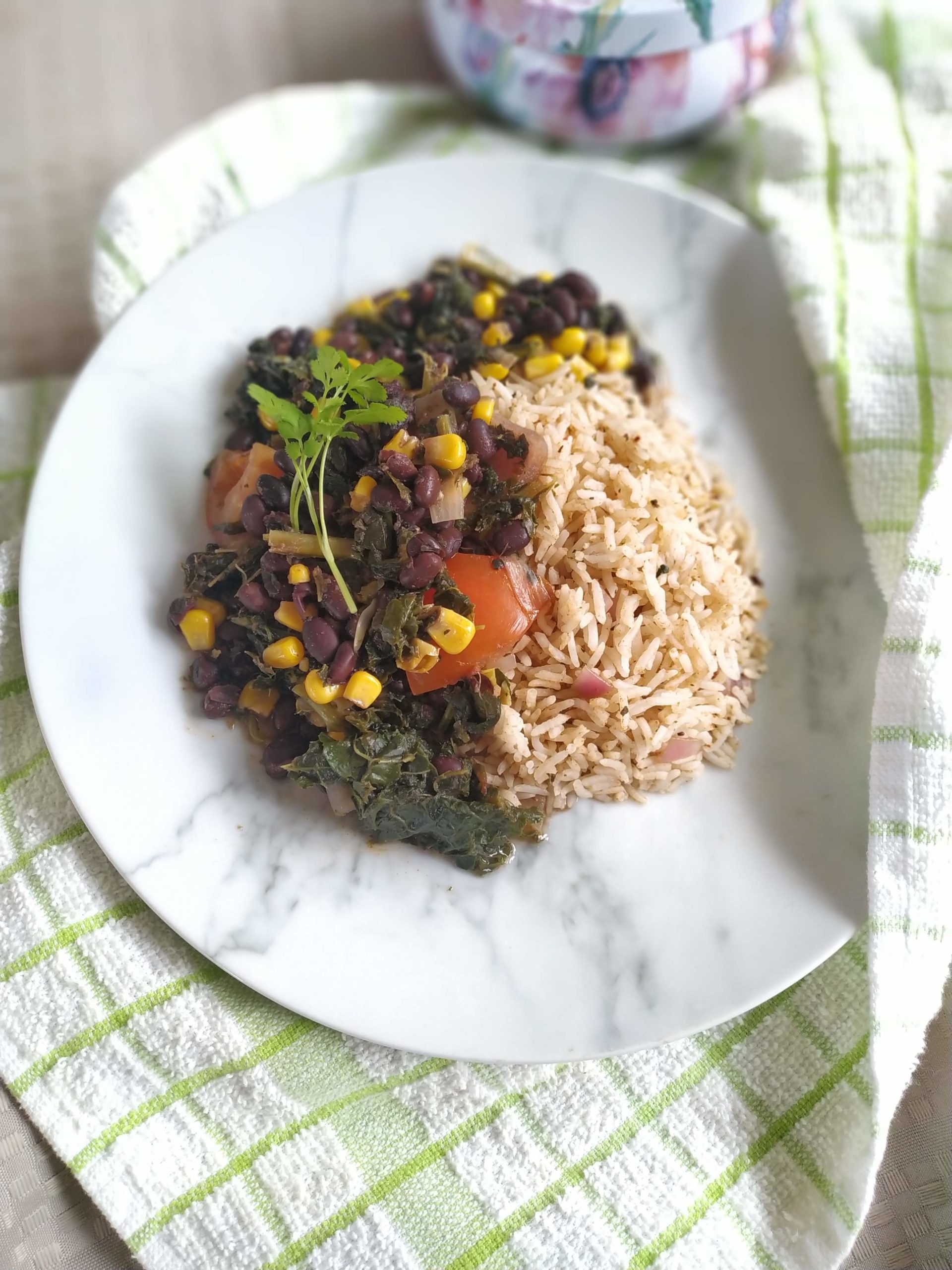 sweet potato kale black bean chili on a white plate