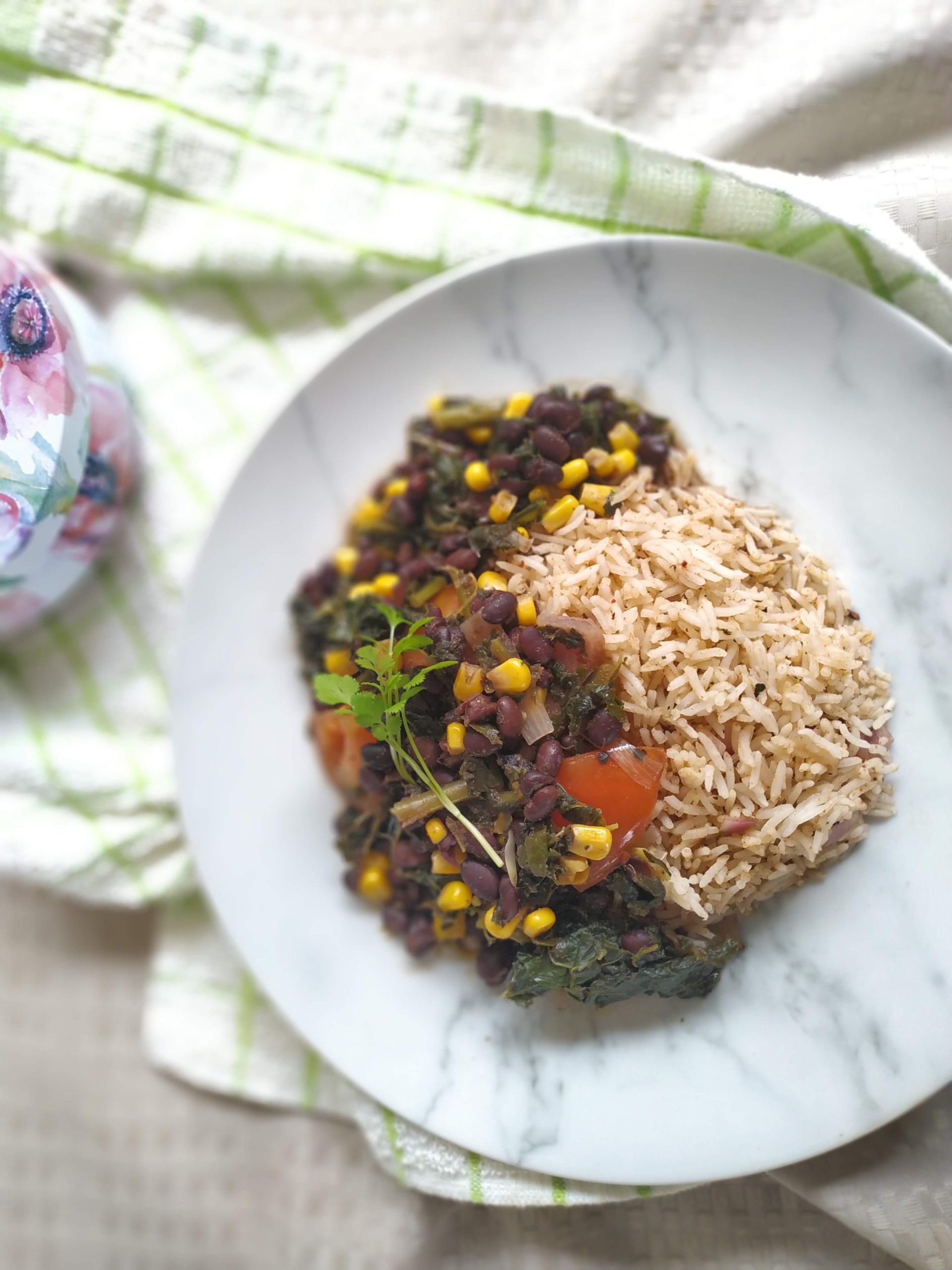 sweet potato kale black bean chili on a white plate