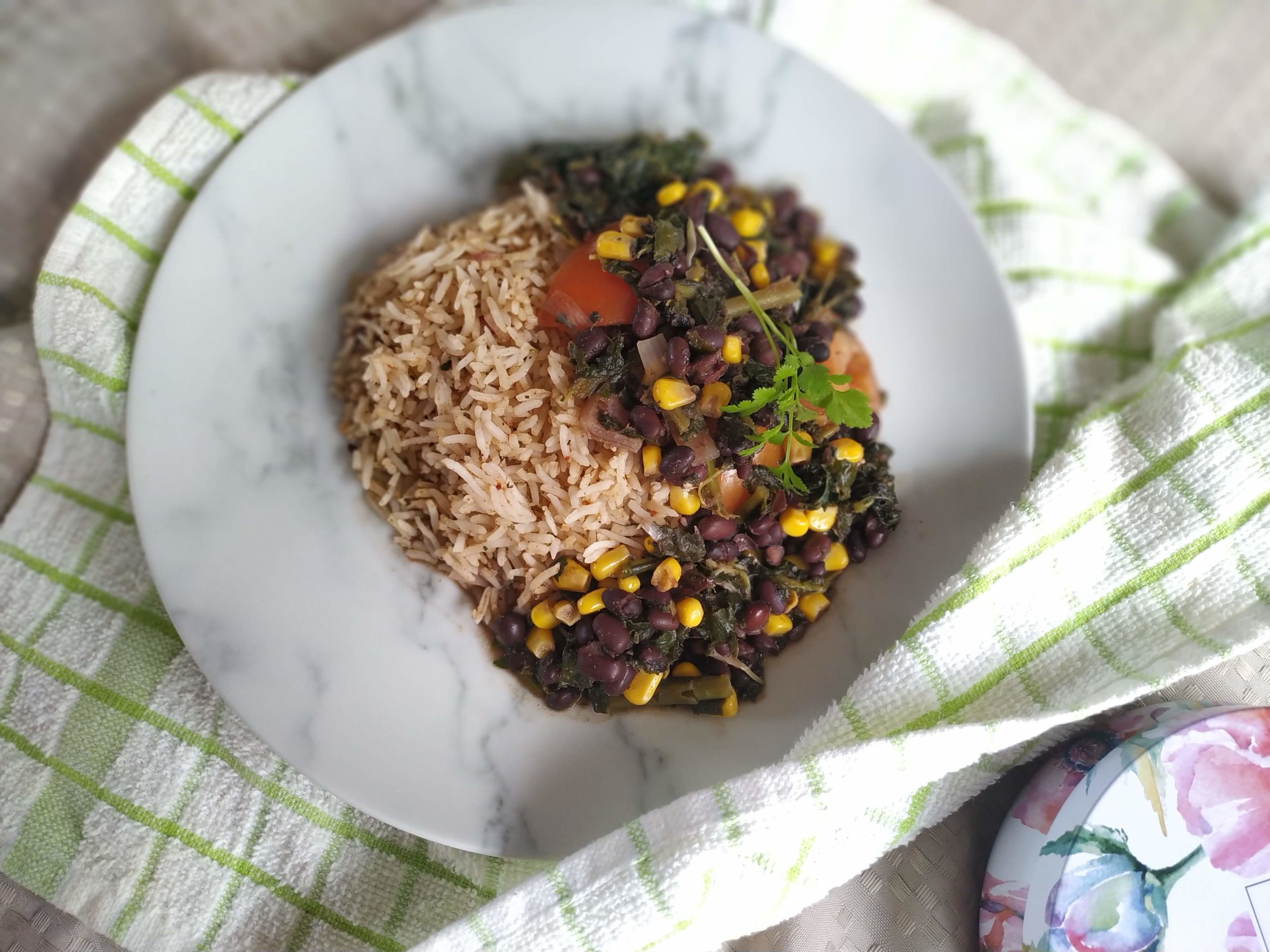 sweet potato kale black bean chili on a white plate