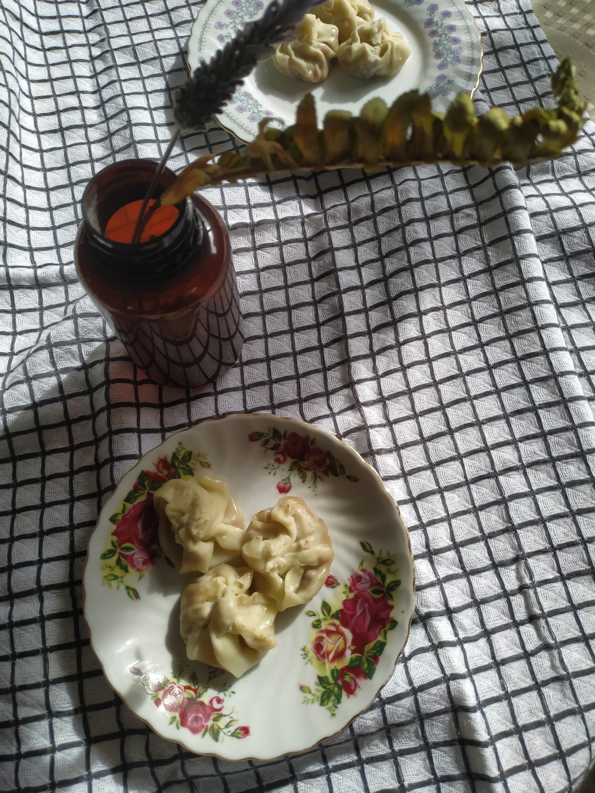 vegan wontons on decorative plates on a tablecloth