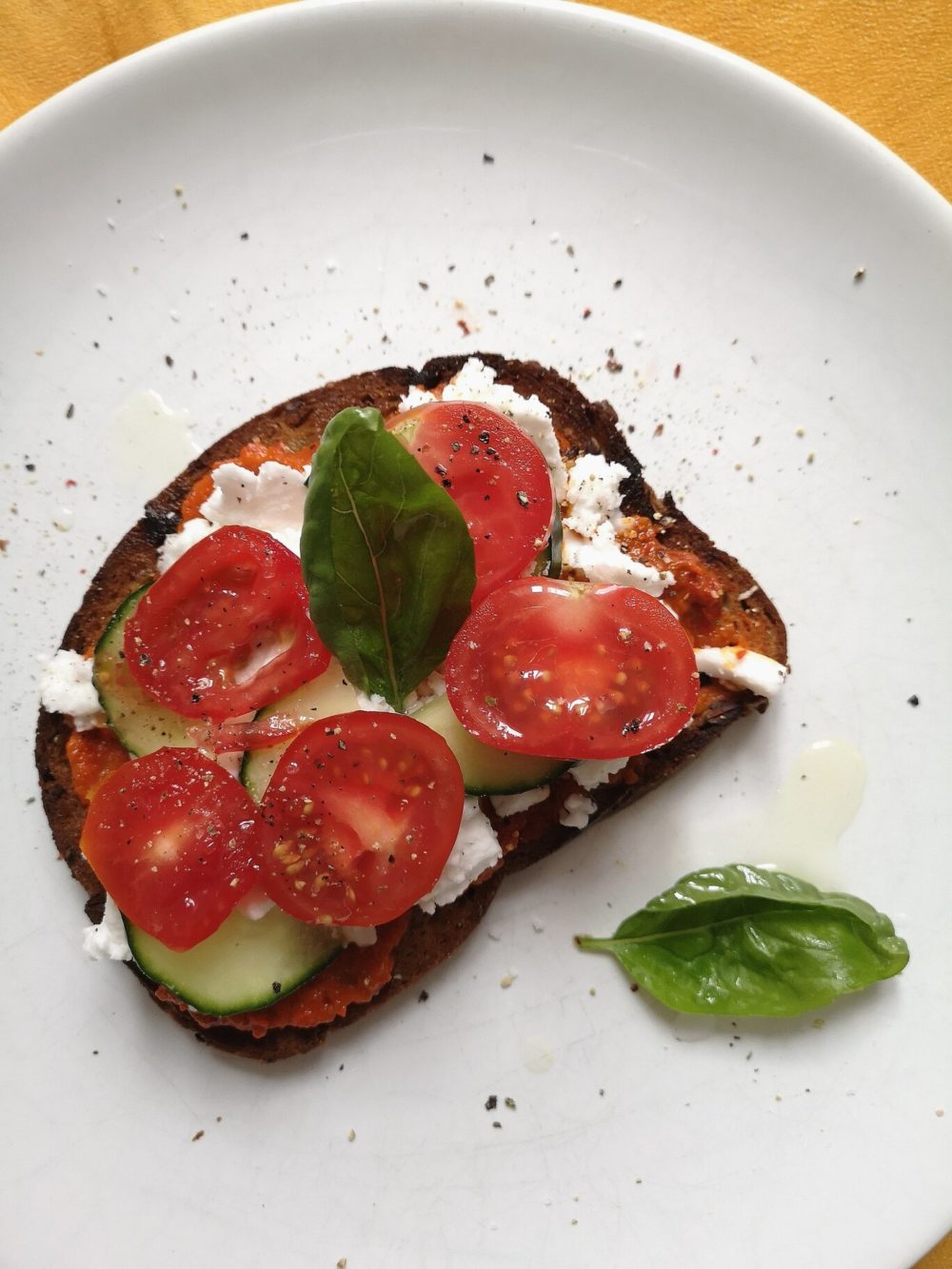 tomato tartine on a white plate