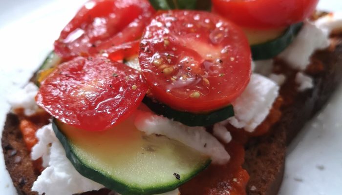 tomato tartine on a white plate