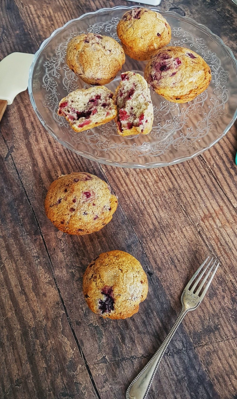 vegan berry muffins on a clear plate