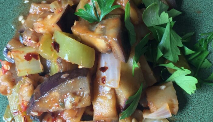 Eggplant Caponata on a green plate