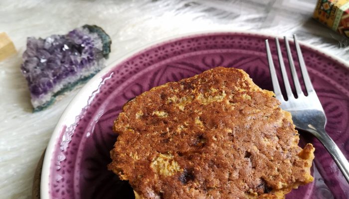 pumpkin banana protein pancakes on a purple plate