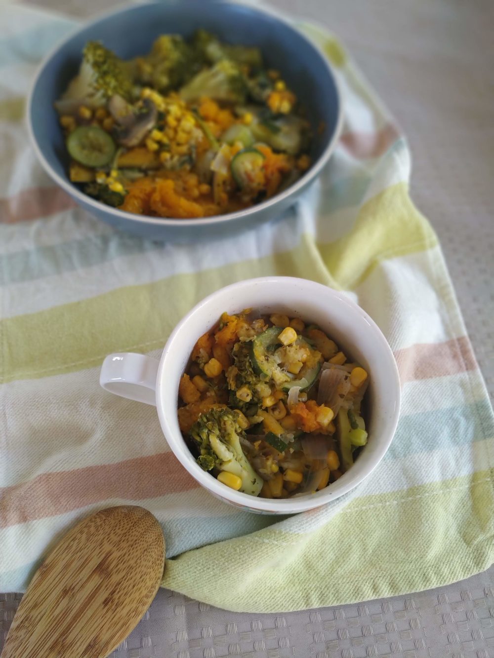 pumpkin stew with broccoli, corn, and mushrooms in two bowls