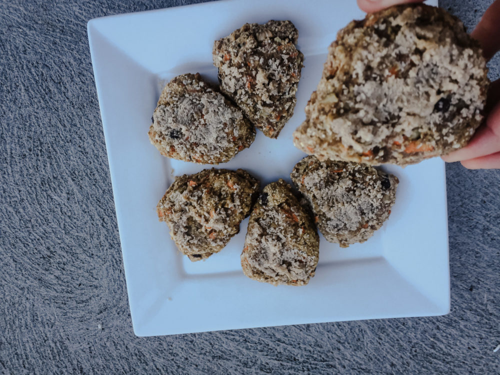 cooked carrot cake scones on a white plate