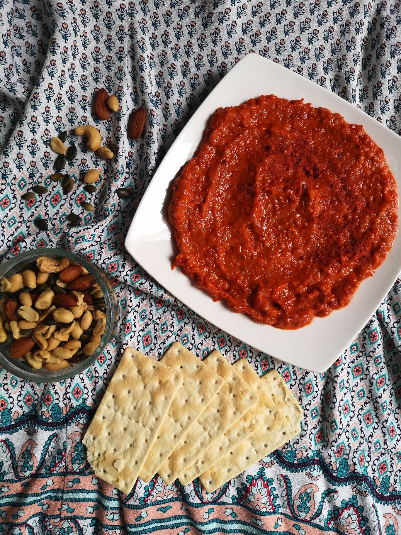 vegan homemade ajvar; roasted pepper spread with crackers and nuts