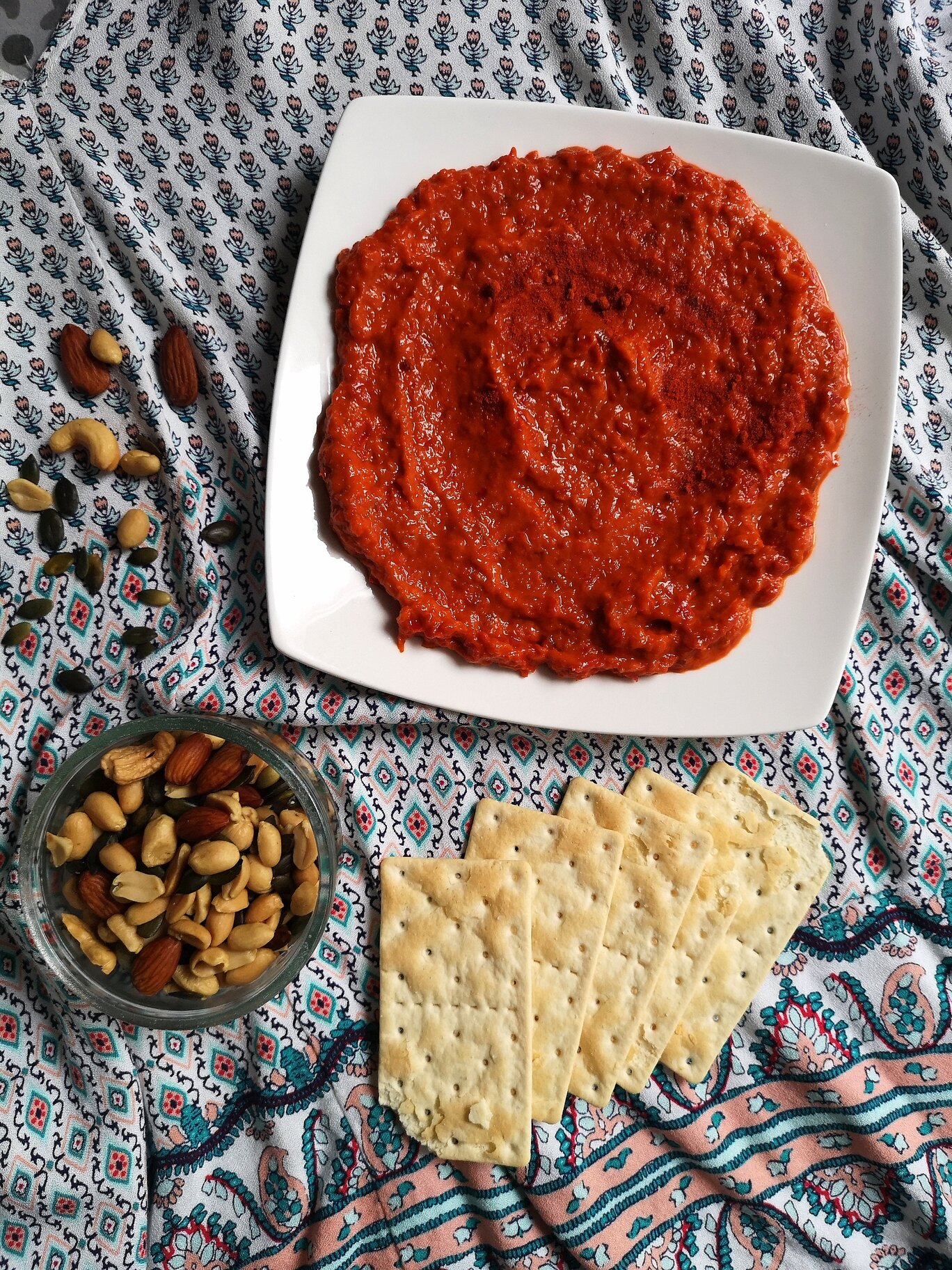 vegan homemade ajvar; roasted pepper spread with crackers and nuts