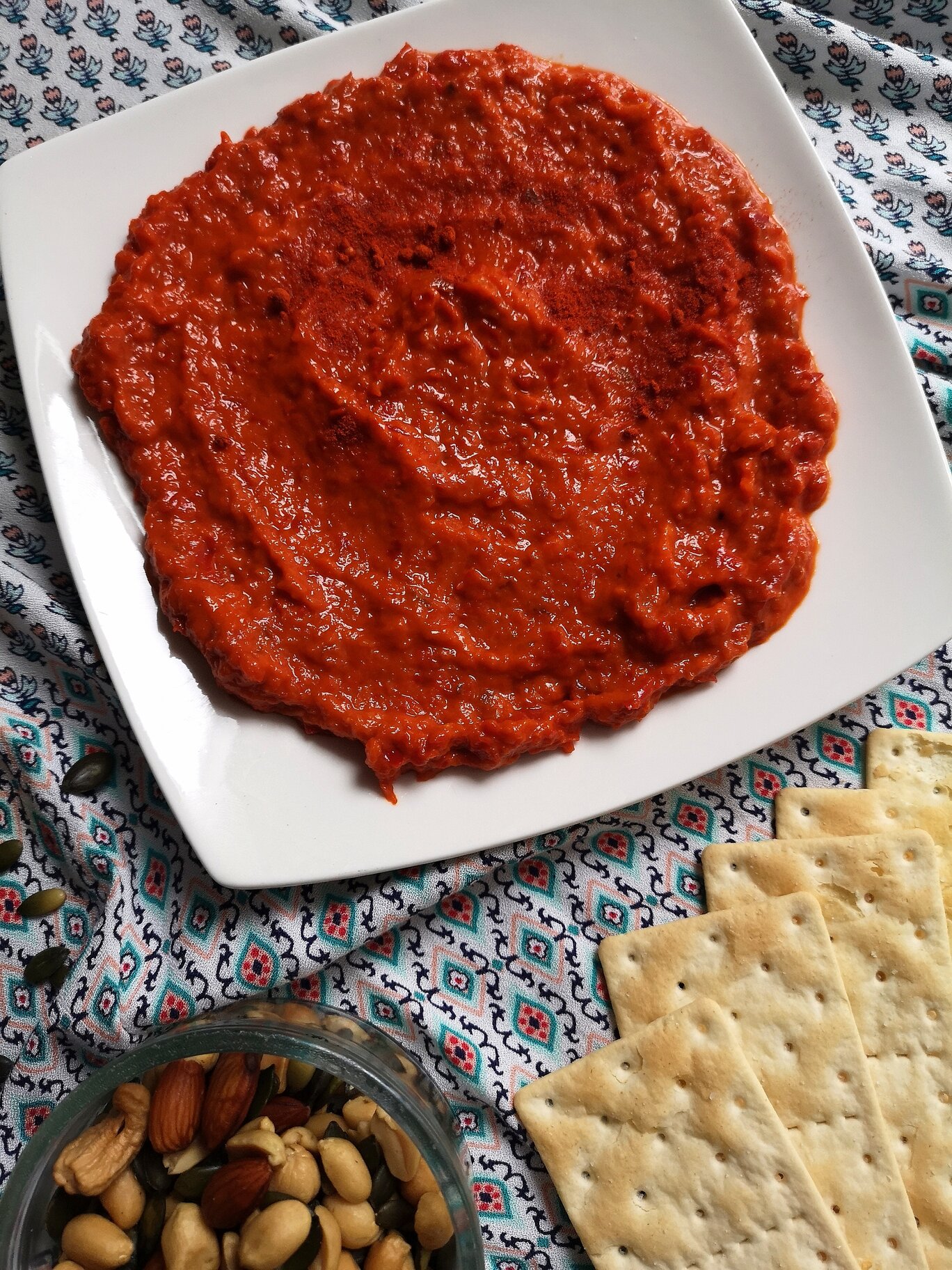 vegan homemade ajvar; roasted pepper spread with crackers and nuts