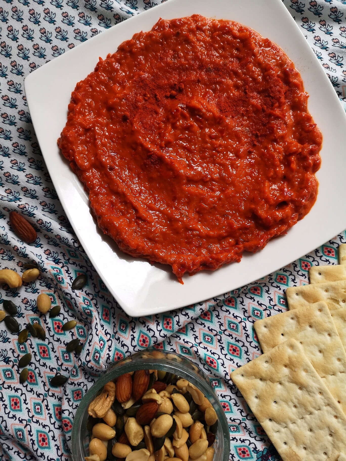 vegan homemade ajvar; roasted pepper spread with crackers and nuts