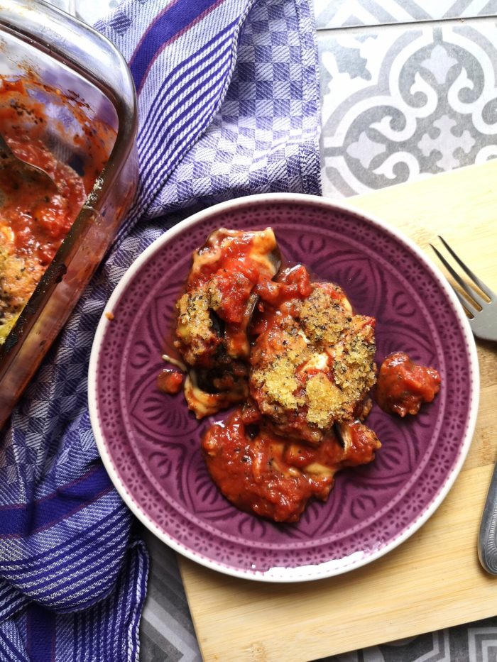 vegan eggplant parmesan on a purple plate