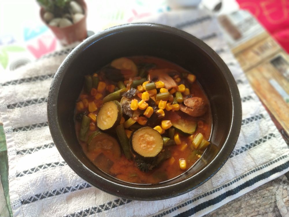 chinese five vegetable stew in a dark bowl