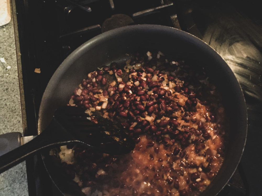 beans cooking in a pan