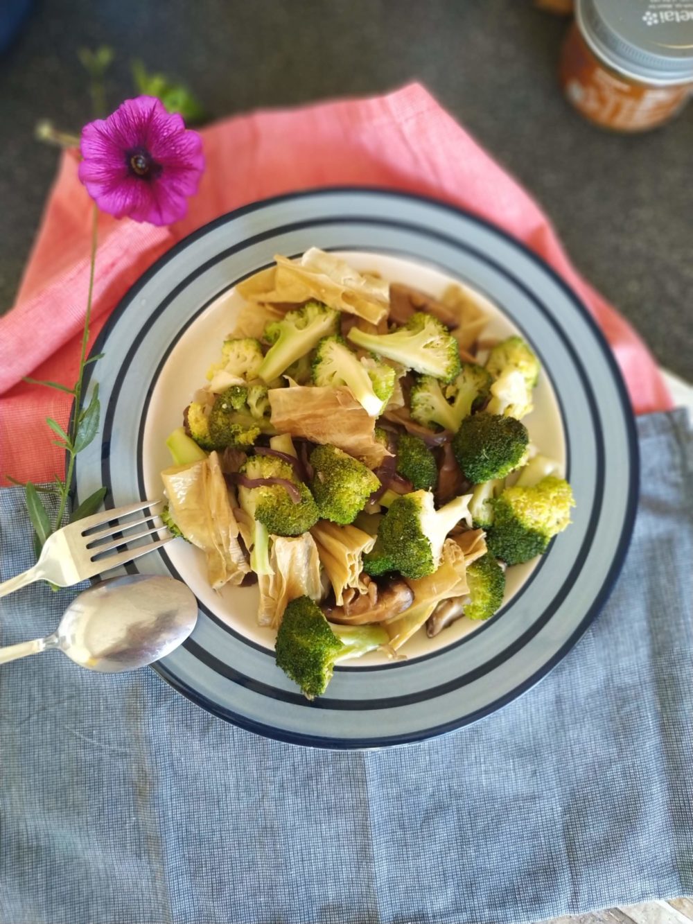 tofu stir fry on a plate with a fork and spoon