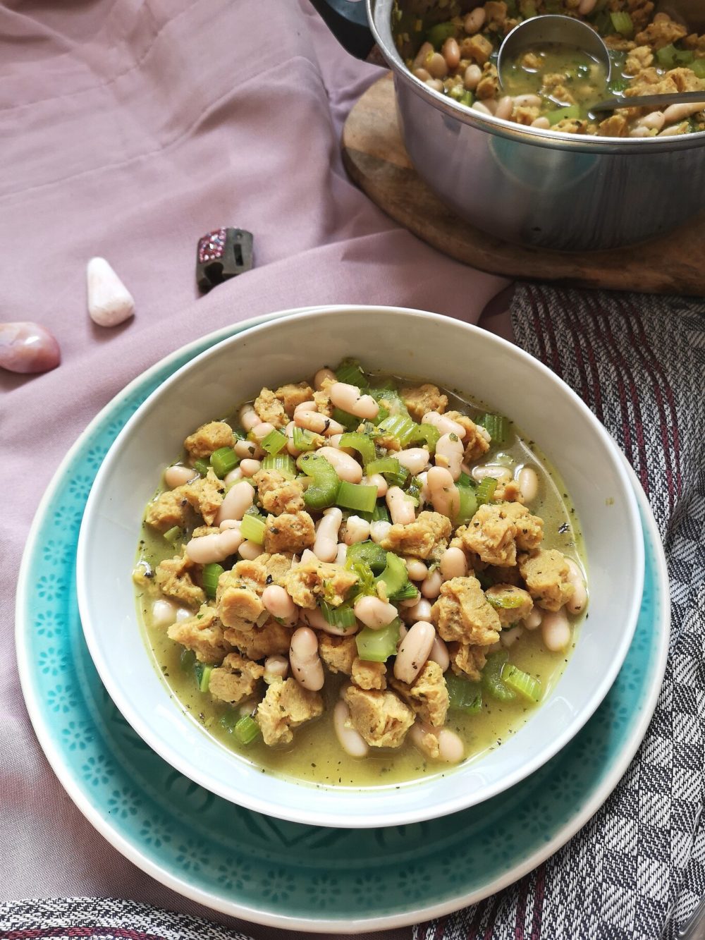 Persian celery stew in a bowl next to crystals