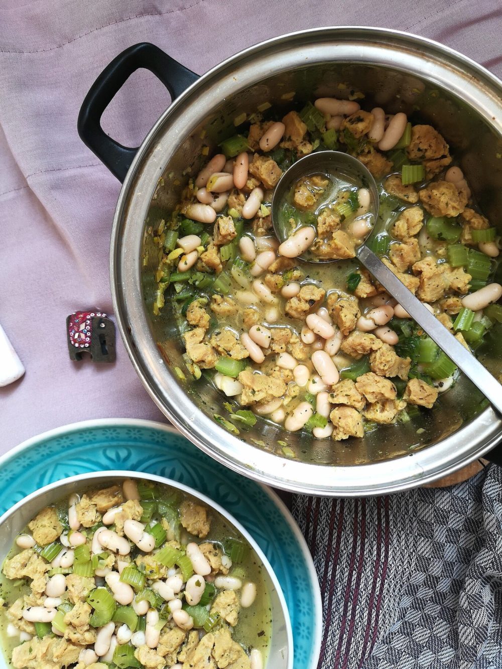 vegan persian celery stew in a bowl with a spoon and crystals