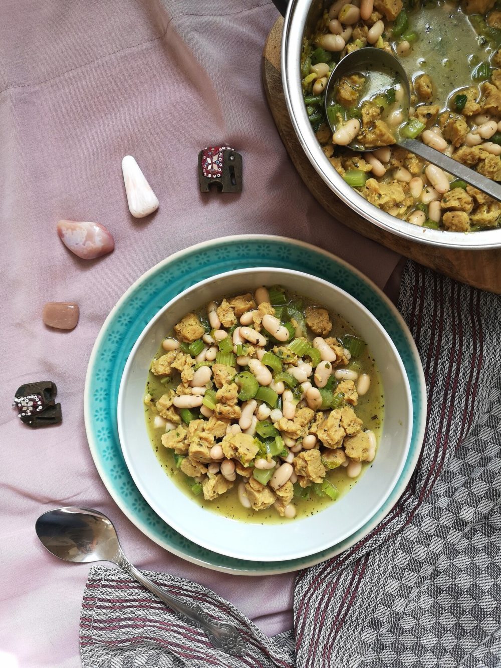 vegan persian celery stew in a bowl with a spoon and crystals