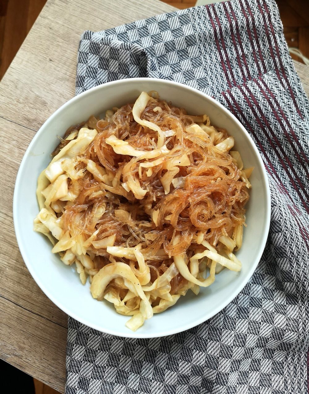 vegan cabbage glass noodles in a white bowl