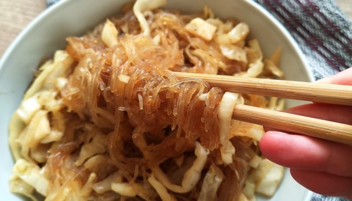 vegan cabbage glass noodles in a white bowl