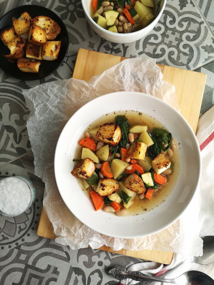 tuscan potato soup in bowls on a table