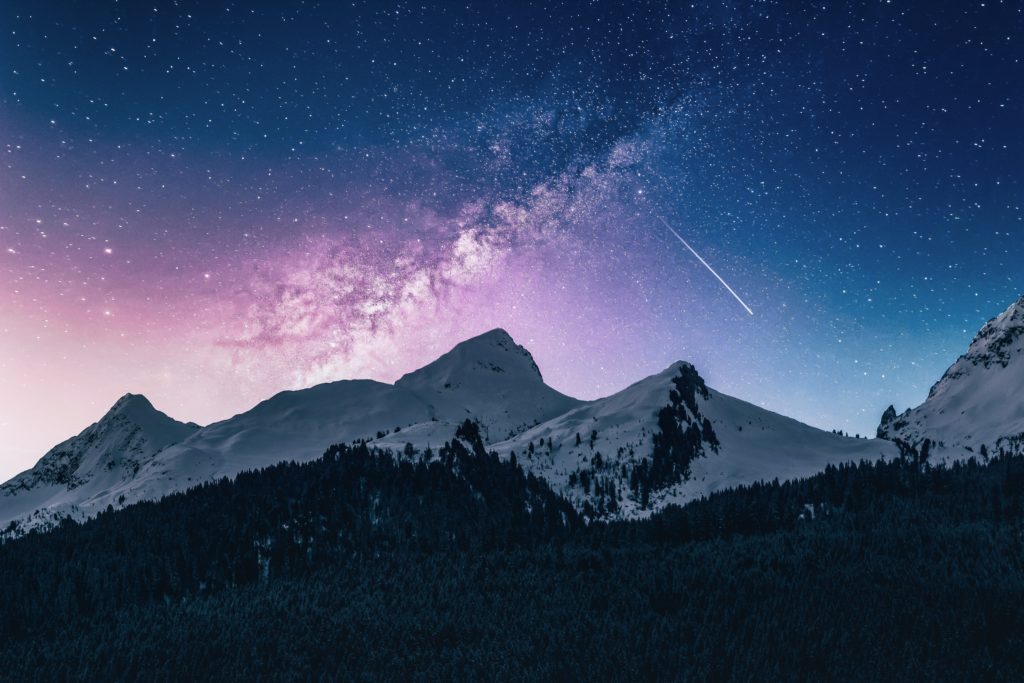 Clear starry sky over a mountain range