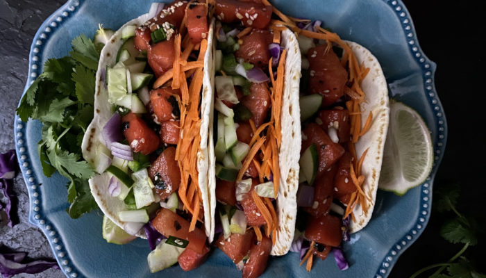 vegan tuna tacos on a blue plate