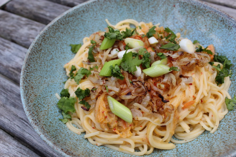 kimchi alfredo linguine in a dish