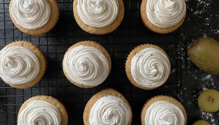 kiwi cupcakes on a cooling rack