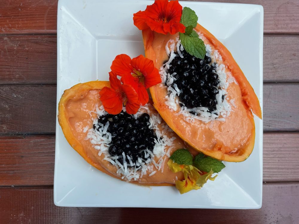 papaya boba smoothie bowl on white plate