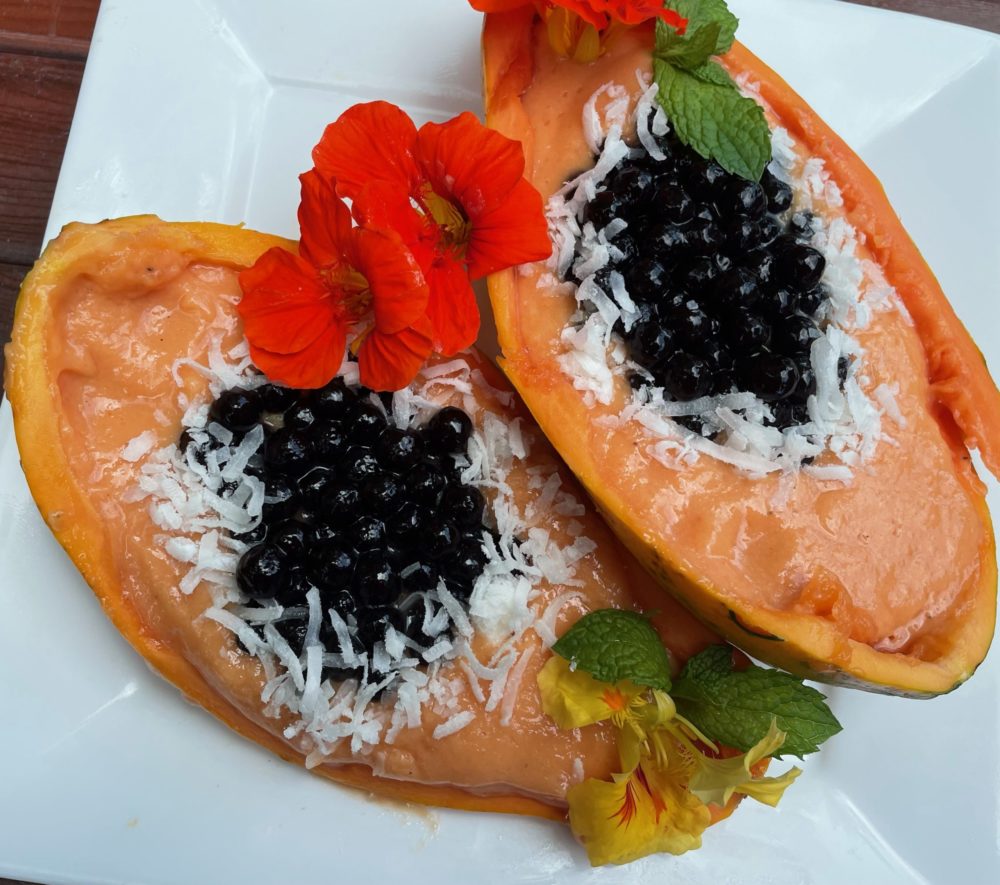 papaya boba smoothie bowl on white plate