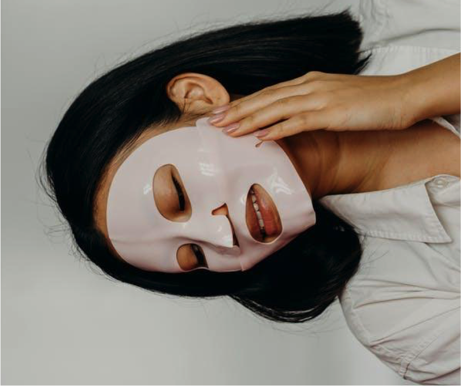 woman wearing korean sheet face mask