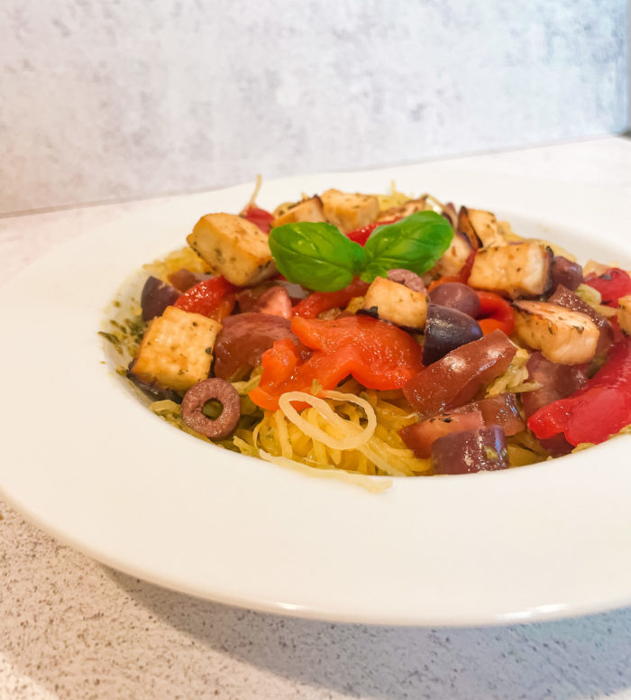 vegan spaghetti squash meal in a white dish