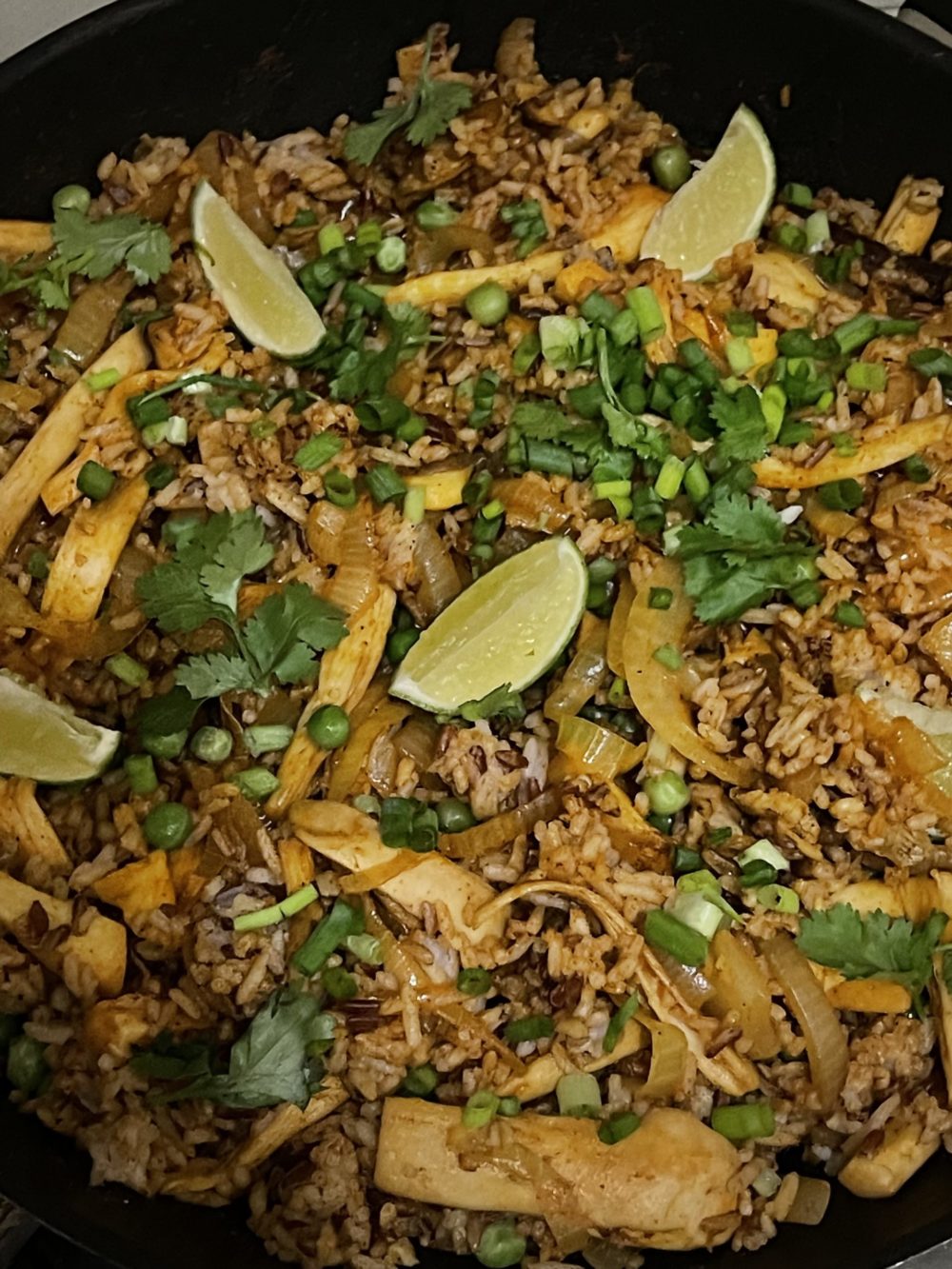 vegan biryani in a dark pan