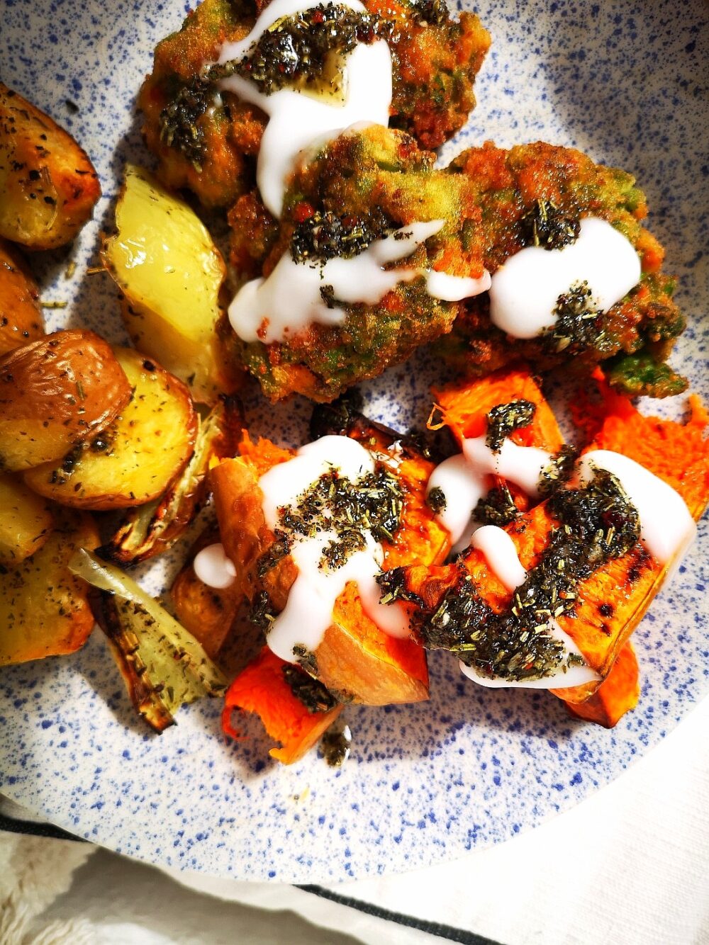 vegan pea croquettes on a white speckled plate