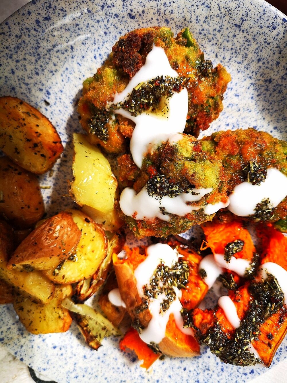 vegan pea croquettes on a white speckled plate