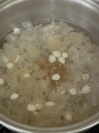 soup ingredients cooking in a silver pot