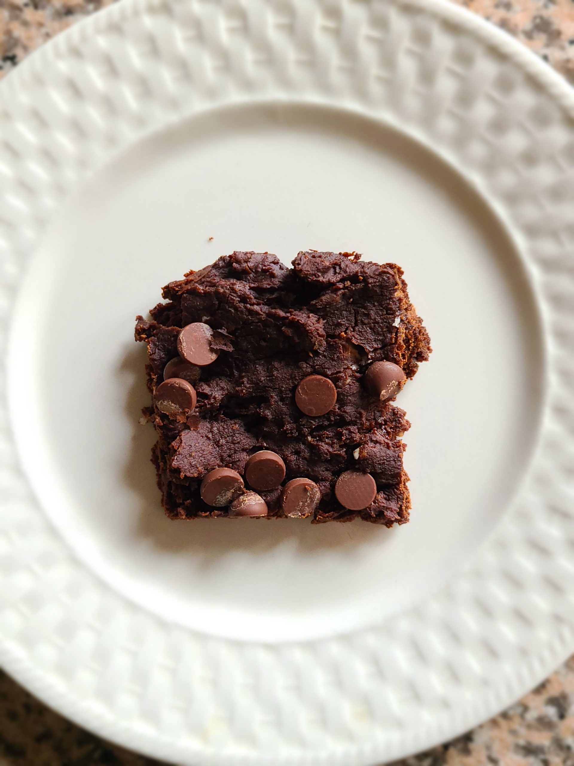 White Bean Brownie square on a white dish