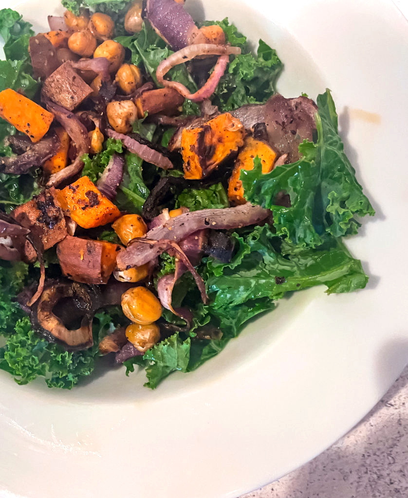 sweet potato kale salad in a white dish