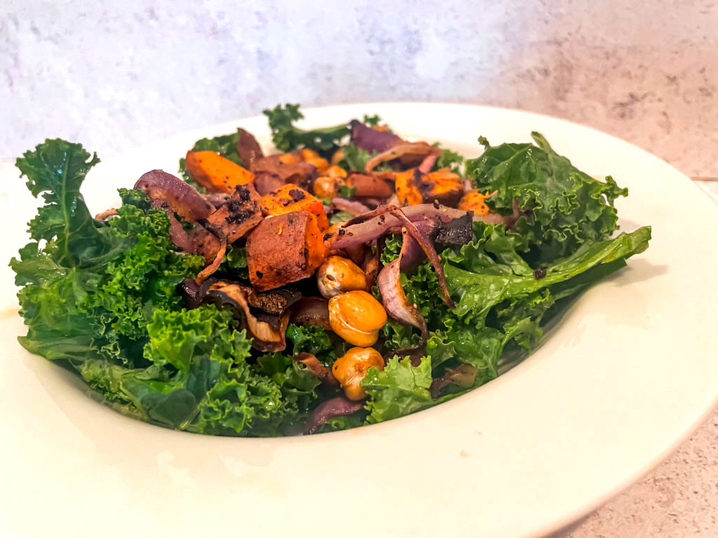 sweet potato kale salad in a white dish