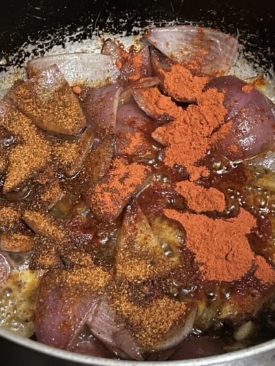 vegetables and spices in a silver pan