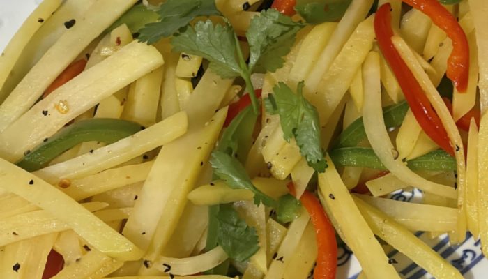 shredded potatoes and bell peppers on a plate